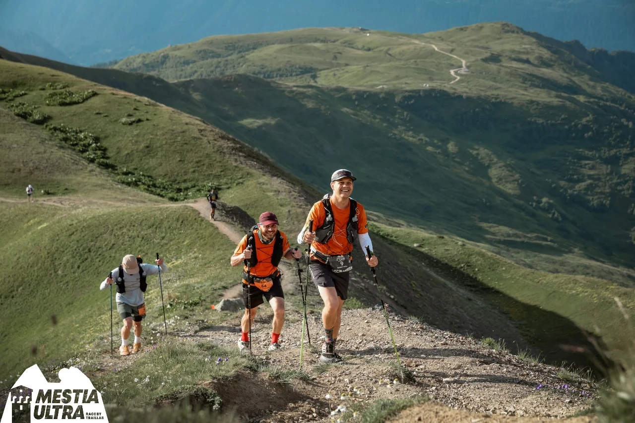 Runners moving along a mountain path